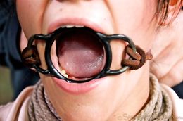 Two older men abuse the throat of a busty bound teen