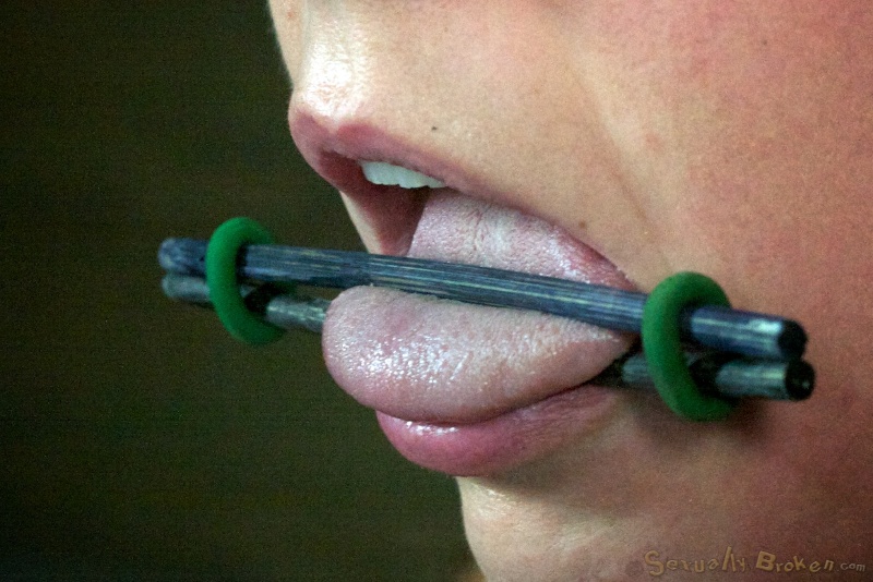 Tongue torture and deep throat rape for captive beautiful whore